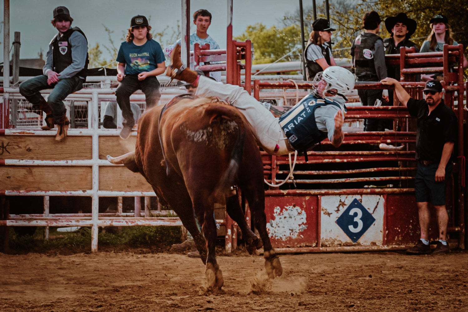 A bull rider getting bucked from a bull.